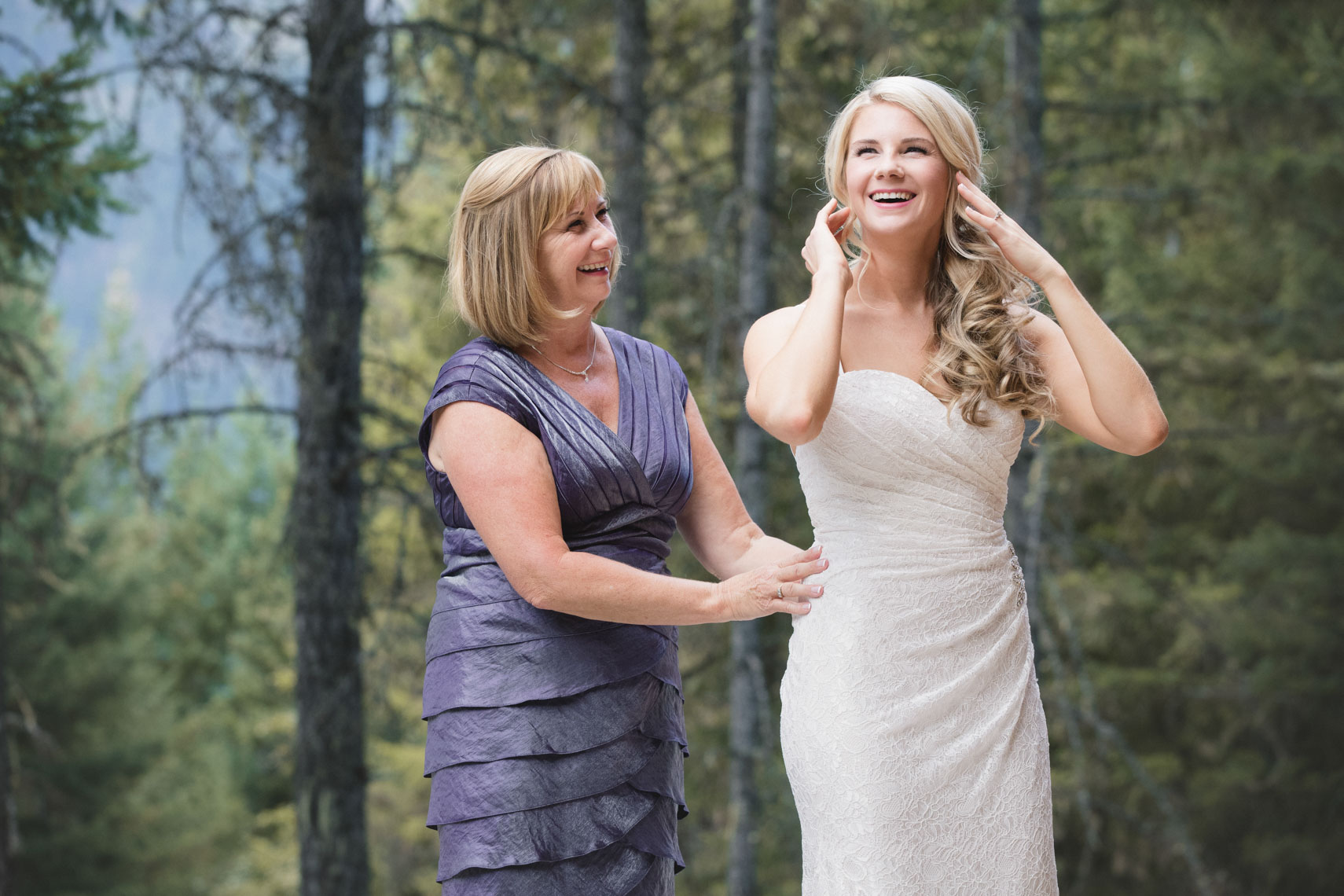 Bride and her mother getting ready before wedding in Whistler