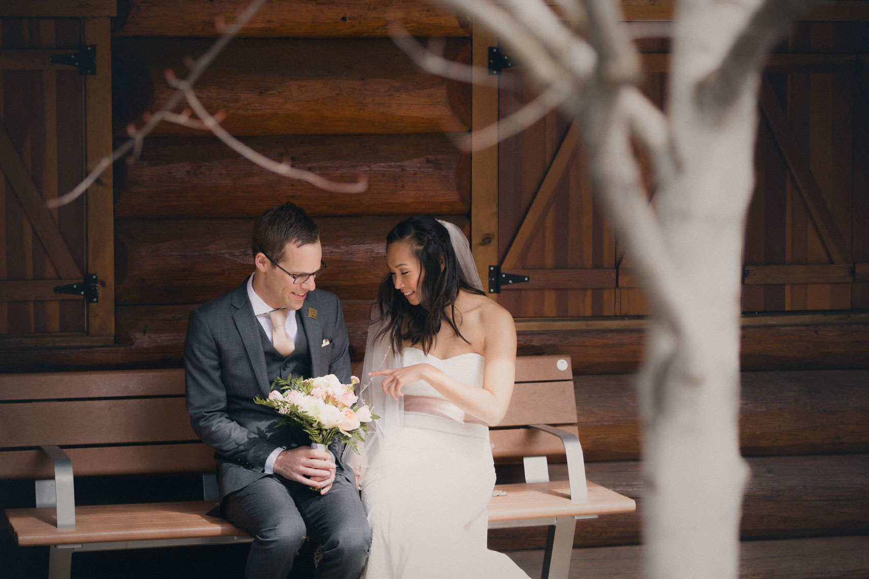 Candid moment between bride and groom at Lost Lake before Whistler ceremony
