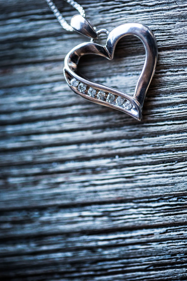 Detail closeup photography of heart shaped necklace during Whistler wedding