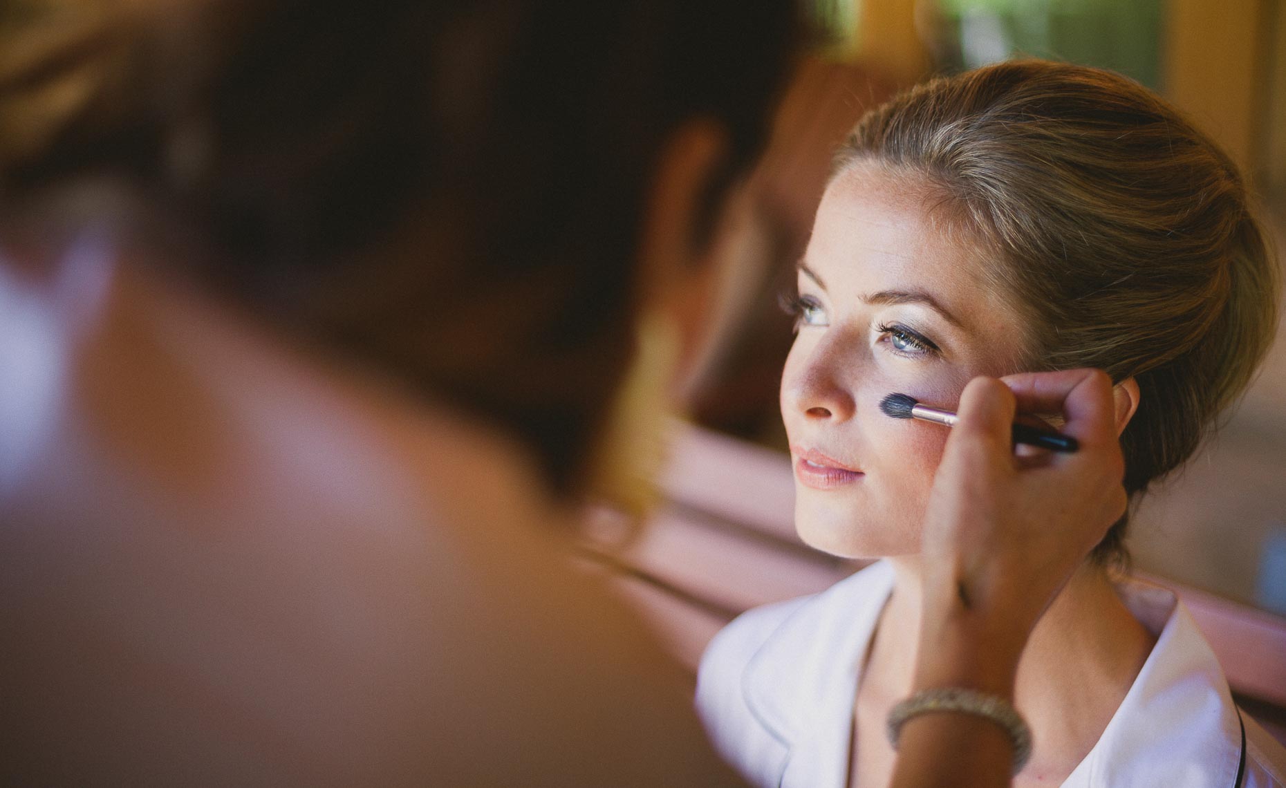 Bride with makeup artist before whistler wedding ceremony